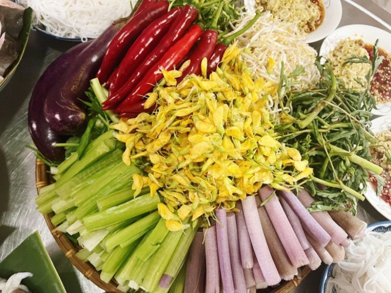 Fresh vegetables served with Lau Mam in the Mekong Delta